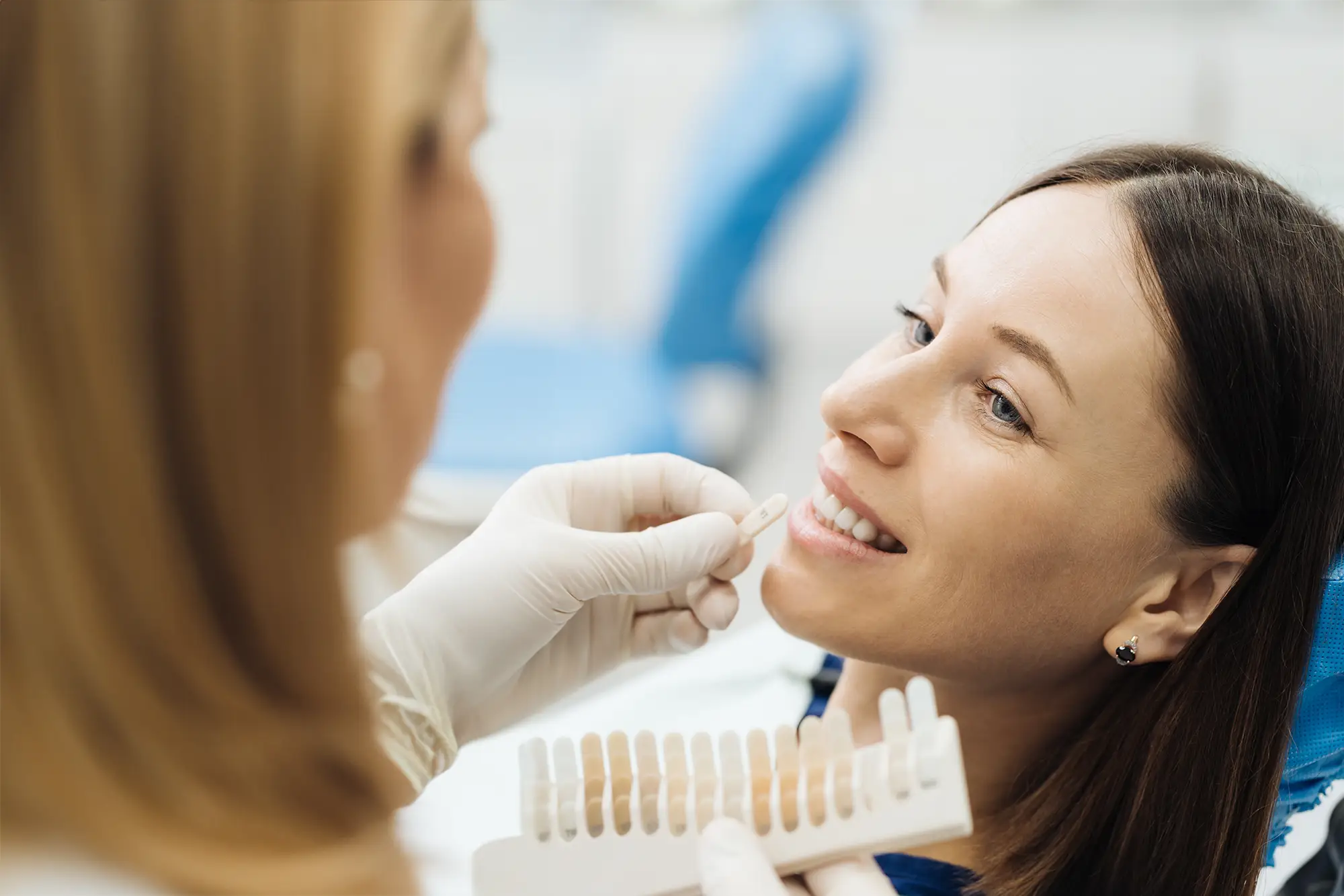 woman touching jaw in pain